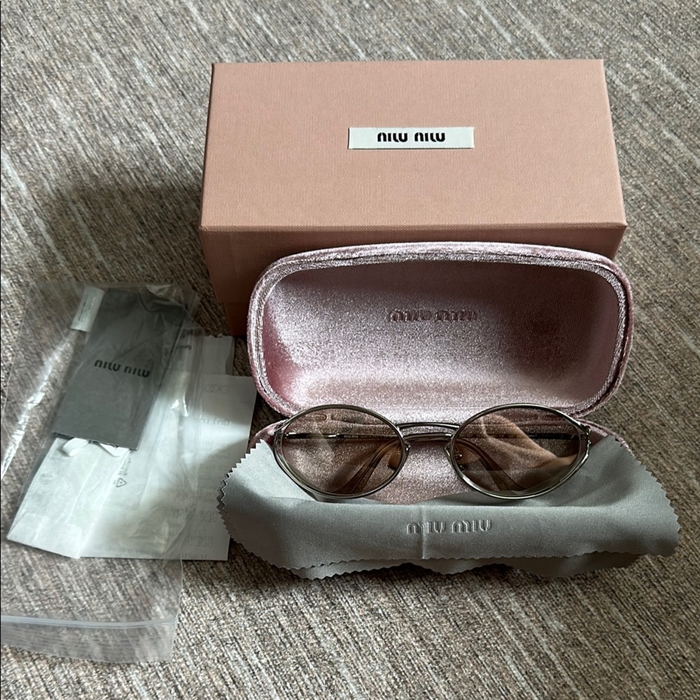Miu Miu Oval Sunglasses
